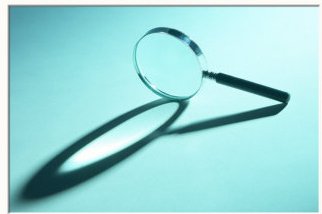 magnifying-glass-on-its-side-with-shadow-in-blue-light-framed-photographic-print-c12758027.jpg